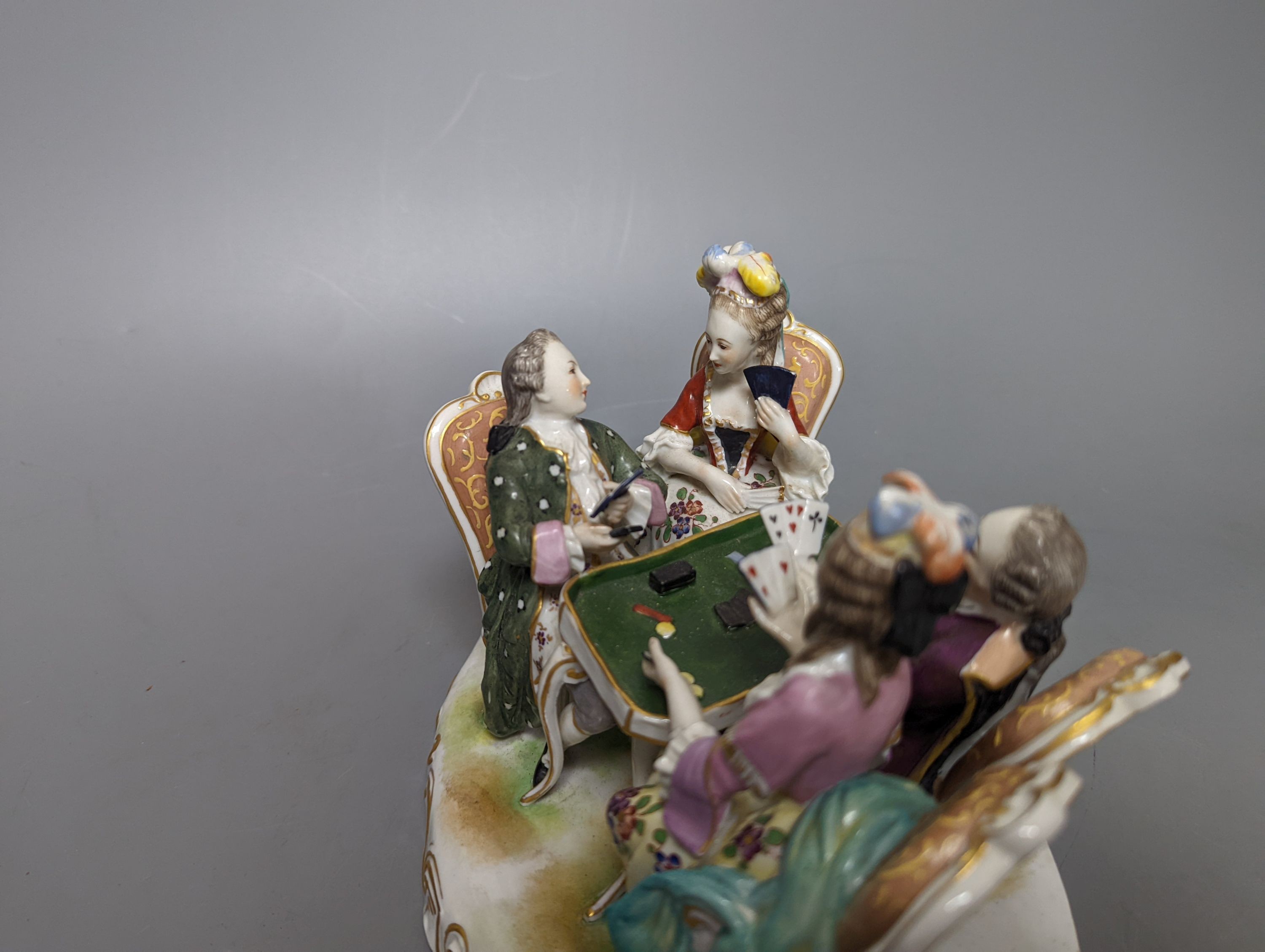 A German porcelain group of figures at a games table 21cm